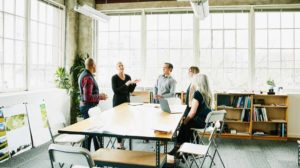 People discussing the characteristics of a successful leadership development strategy and effective leadership development approach