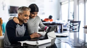 employee at home with daughter representing holistic leadership