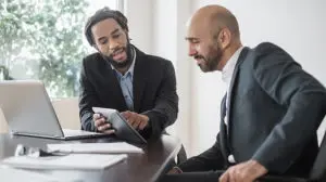 man and woman talking about convincing your boss to pay for training