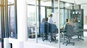 people in a room discussing the senior leadership team