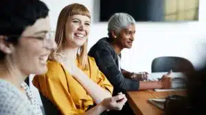 women employees talking at work representing women and leadership concept